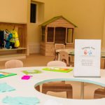 A classroom at Leafield House Nursery featuring a table and chairs.